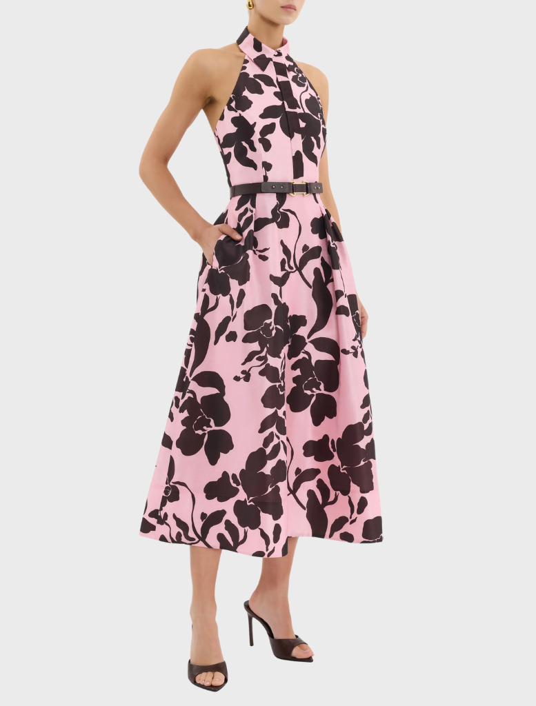Elegant Connie Halter Midi Dress adorned with a pink and black floral pattern, ideal for various occasions.