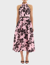 Connie Halter Midi Dress featuring a vibrant pink and black floral print, perfect for a chic summer look.