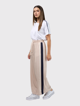 Wide leg pant in stone and navy, designed with an elastic waist, adjustable ties, and contrasting tape on the side seams.
