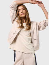 Stone and navy cotton tee featuring a round neckline and contrast tape detailing on the overarm and sleeves.