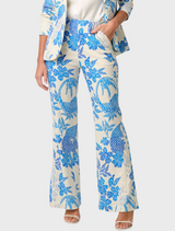 A woman dressed in a blue and white floral suit, showcasing the Leandro Contrast Lace Linen Viscose Stretch Pant design.