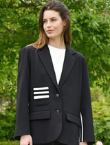 Black Cooper Club Jacket displayed on a hanger, featuring a sleek design and modern fit for stylish outerwear.