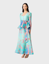 Blue multi-patterned coral long sleeve maxi dress, showcasing a graceful fit and vibrant colors for a chic appearance.
