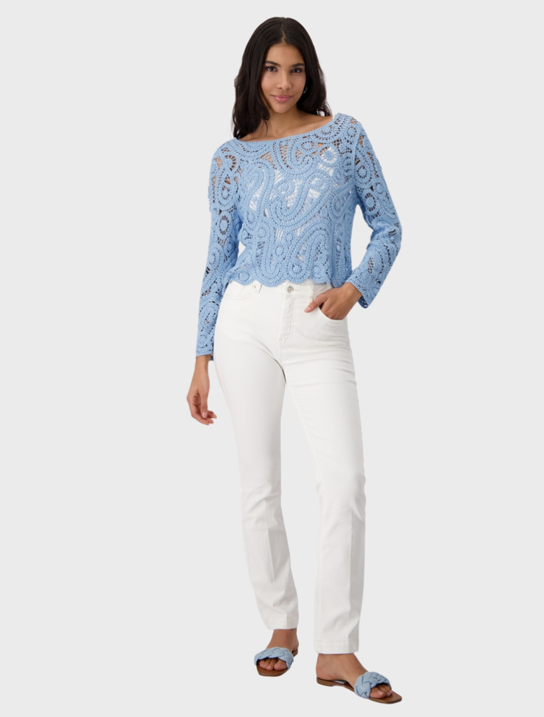 A blue crochet sweater, beautifully crafted with intricate patterns, perfect for stylish layering.