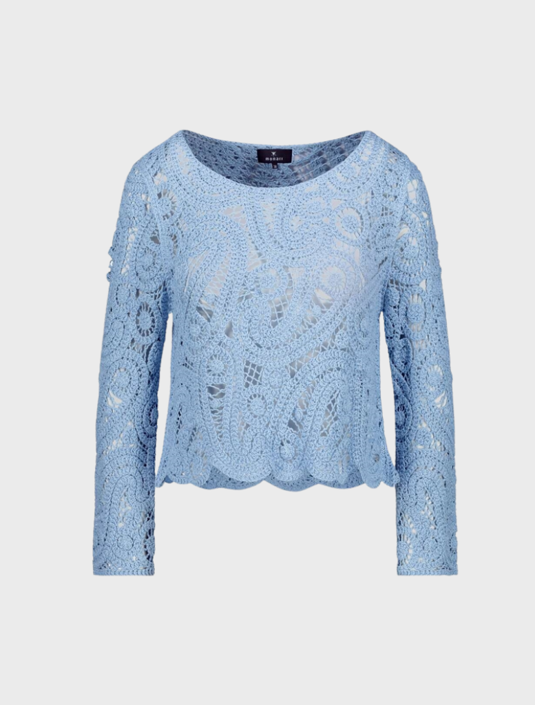 A stunning blue crochet sweater, highlighting its elegant texture and vibrant color.