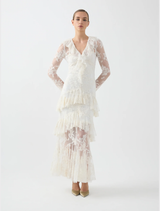 Antoinette Dress in cream, showcasing scalloped lace and cascading frills, designed for fluid movement and romantic style.