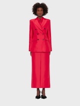  Red suit featuring a long skirt and matching jacket, showcasing a stylish and elegant design.