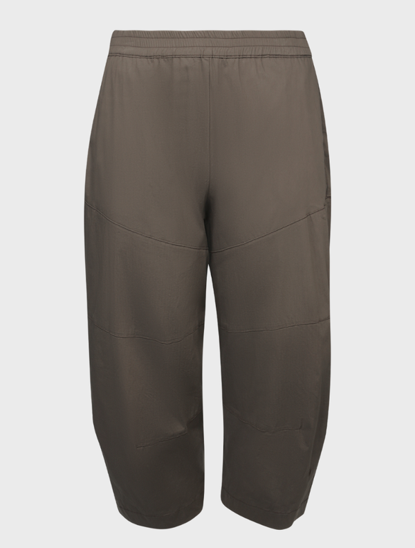 A pair of hide cropped Tuscan pants lay flat, highlighting their tailored fit and stylish appearance for versatile outfits.