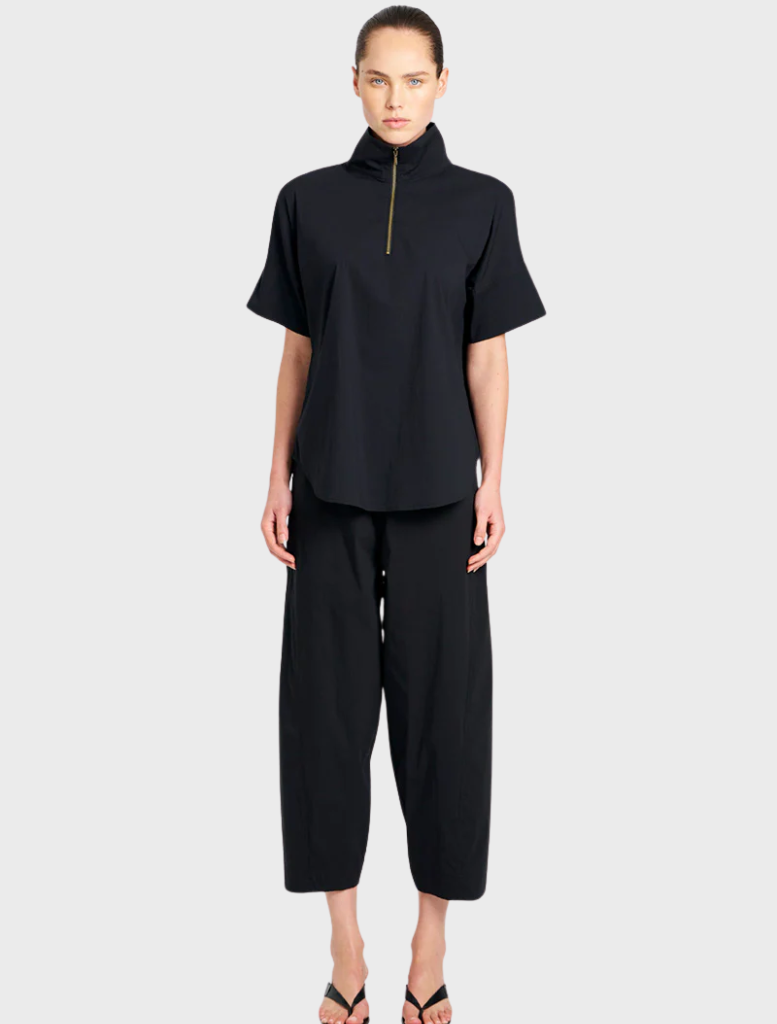 Black cross pants displayed on a white background, showcasing a sleek and modern design suitable for various occasions.