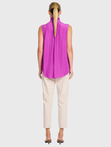 Dahlia's Rufflet Tank includes a ruffle detail at the collar, gathered shoulders, and a fluid, non-stretch design for comfort.