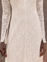 Timeless off-white jacquard lace dress with feminine V-neck and airy flounce hem, suitable for special summer events.