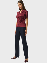 Women's dark blue jeans with a high waist, emphasizing a contemporary and fashionable look.