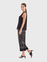 Black Darling Vest showcasing a sleeveless design, soft lustre fabric, and functional pockets for a polished appearance.