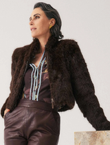 Cropped walnut faux fur jacket with a soft texture, perfect for stylish layering in cooler weather.