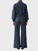 Stylish denim bomber jacket with pockets, ribbed cuffs, and crystal details, blending polish with utilitarian design.