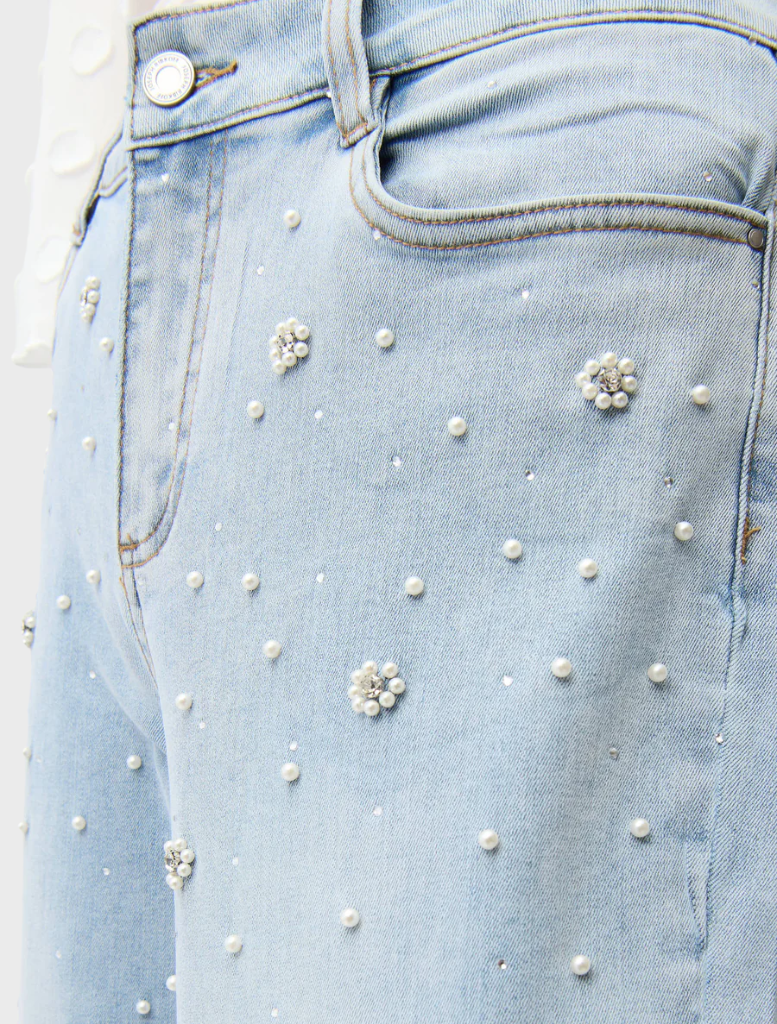 Casual light blue denim spring pants shown on a plain backdrop, ideal for spring fashion and everyday wear.