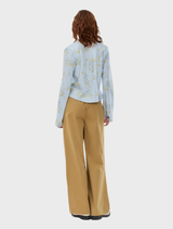 Brown wide-leg pants with a casual style, equipped with side pockets and a drawstring waist for a customizable fit.