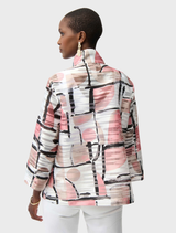 Back view of a woman in a pink and black abstract print jacket, showcasing the unique design of the Organza Abstract Jacket.