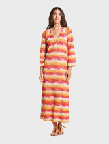 Women's long red dress featuring a colorful striped fabric design, showcasing a vibrant and stylish appearance.