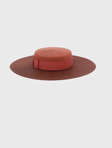 Stylish rose pink boater hat by Morgan & Taylor, designed for formal occasions, with a structured shape and adjustable cord.