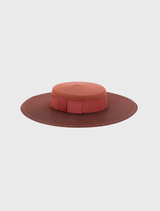 Morgan & Taylor's rose pink boater hat, designed for racewear, with a structured shape and internal cord for comfort and security.