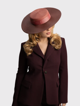 Rose pink boater hat by Morgan & Taylor, featuring a structured design and internal cord for secure styling on race day.