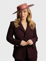 Contemporary rose pink racewear boater hat with tonal detailing and internal cord for comfort and secure fit during events.