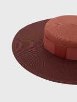 Elegant rose pink racewear boater hat with a structured design and internal cord for secure styling, perfect for race day.