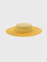  Stylish yellow racewear boater hat with block color detailing and internal cord for comfort, suitable for various occasions.