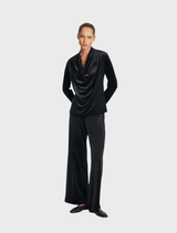 Black drape top with a flowing design, suitable for casual or formal occasions.