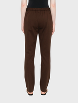 Brown wool pants with a high waist, emphasizing a chic silhouette, set against a simple white background.

