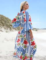 A blue multi-patterned dress with a relaxed fit, perfect for outdoor events or casual summer outings.