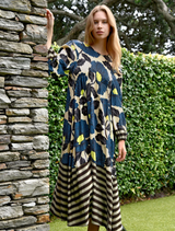 Lime and blue floral dress with satin fabric, balloon sleeves, and contrast detailing for an elegant feminine silhouette.