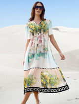 Elegant pink dress with a paint splatter design, perfect for formal occasions and stylish events.