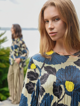 Lime and blue floral dress with a shirred bodice, balloon sleeves, and elegant contrast detailing for a sophisticated look.