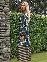 Elegant lime and blue floral dress featuring satin fabric, balloon sleeves, and a shirred bodice for a sculpted fit.