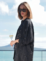 Elegant black shirt with shimmering sequins and embroidery, designed in a relaxed boyfriend fit for everyday wear.