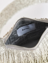 Silver Drip Birch Bag featured prominently, illustrating its chic design and versatility for various occasions.