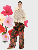 Brown dual trousers displayed on a hanger, showcasing a sleek design suitable for formal or casual wear.
