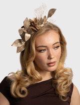Gold fascinator with floral trims and lace detailing, featuring a fitted headband for comfort and effortless styling.