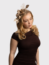 Traditional-style gold fascinator with floral decorations and lace, featuring a comfortable fitted headband for easy styling.