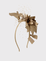Modern gold fascinator adorned with soft floral trims and lace, designed for comfort with a fitted headband.