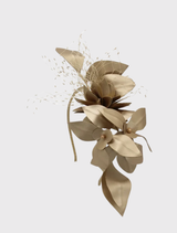 Gold fascinator with floral trims and lace detailing, featuring a fitted headband for comfort and effortless styling.