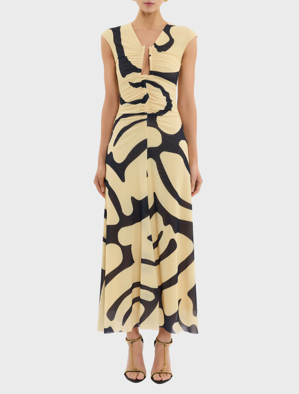 A Dune Midi Dress with a bold yellow and black pattern, perfect for a chic and fashionable look.