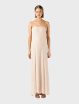 A glittering slip dress designed in the Gatsby fashion, highlighting its luxurious texture and eye-catching embellishments.