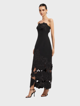 Elegant ebony maxi dress with a detailed appliqué bustier, perfect for formal occasions.