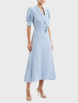 Elegant Effie Midi Dress in pale blue, showcasing a stylish midi length and graceful design.