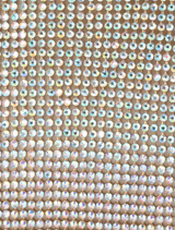 Metallic crystal clutch bag featuring a contemporary design, suitable for enhancing evening attire.