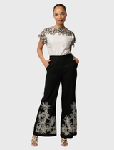 Ivory Eleanor Top with a relaxed fit, cap sleeves, and embroidered shoulders, made from a buttery cupro blend material.