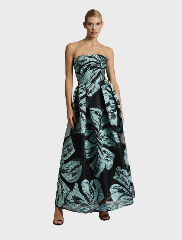 The Bella Gown in Mint Black showcases a strapless design with a vibrant black and green leaf print
